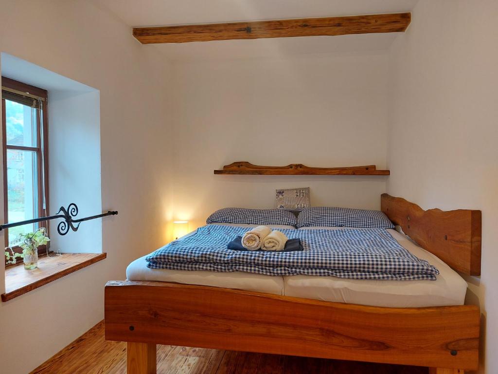 Postel nebo postele na pokoji v ubytování Dvůr u Špraňku
