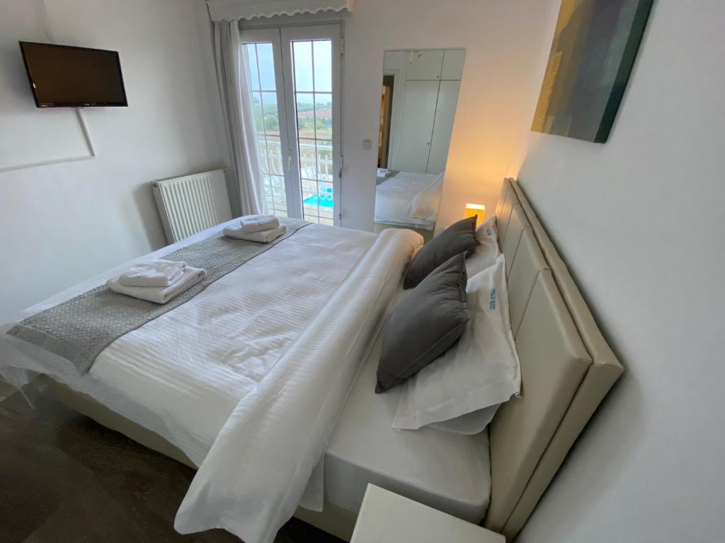 Łóżko lub łóżka w pokoju w obiekcie Villa Blue Apartments