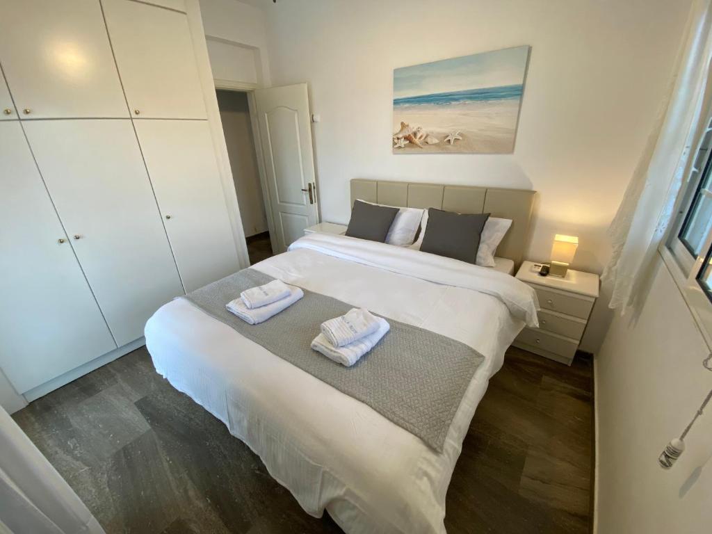 Łóżko lub łóżka w pokoju w obiekcie Villa Blue Apartments