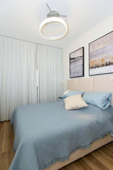 Postel nebo postele na pokoji v ubytování Aphrodite Suite