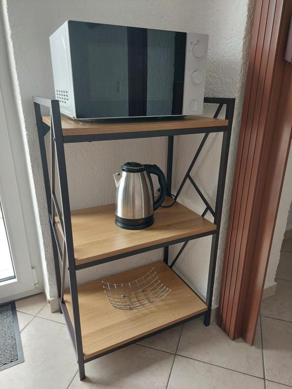 TV a/nebo společenská místnost v ubytování Stella Apartmani Malinska Samoborska 9