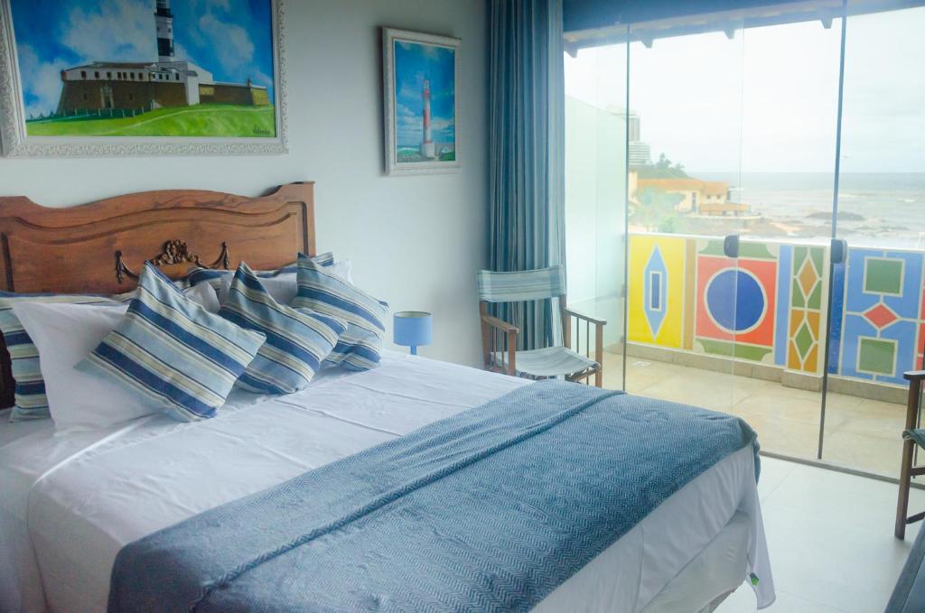 Postel nebo postele na pokoji v ubytování Pousada e Hostel Chez Marianne
