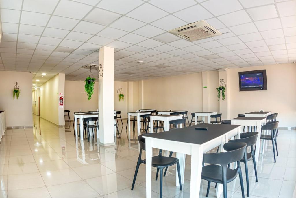 A restaurant or other place to eat at Mensú Grand Hotel