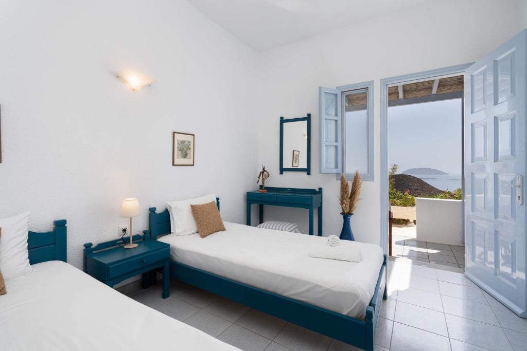 Postel nebo postele na pokoji v ubytování TA PLAGIA accommodation