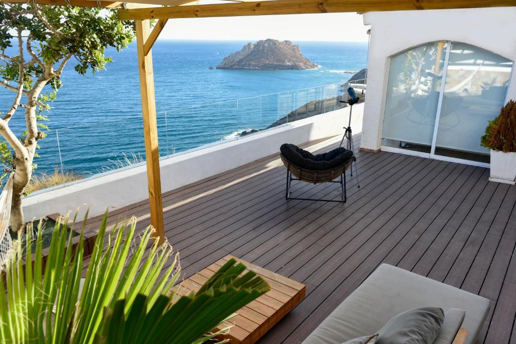 a balcony with a view of the ocean at DELFIN Luxury Villa Water Front Jacuzzi in Águilas