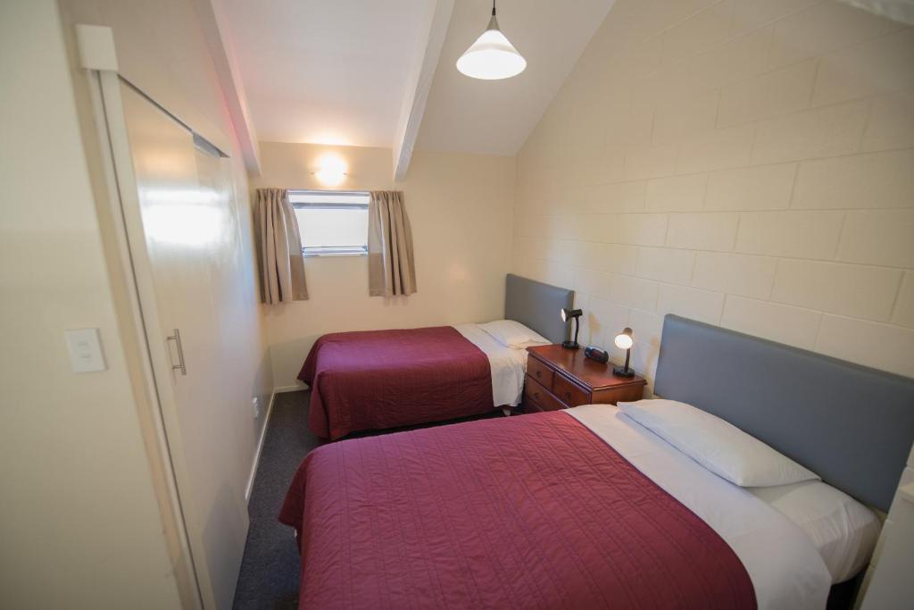 Postel nebo postele na pokoji v ubytování Howick Motor Lodge