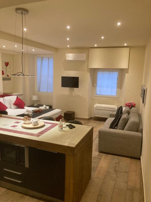 a large living room with a couch and a table at Borgo20 Firenze in Florence