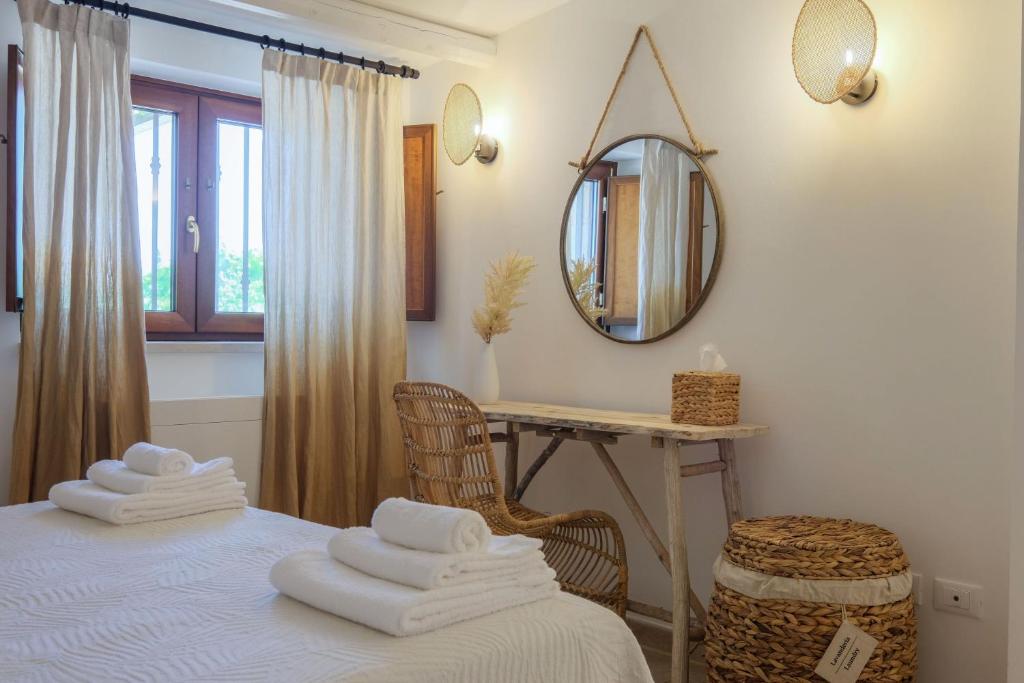 A bed or beds in a room at Trullo Natù - private villa