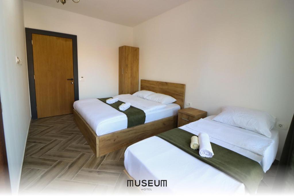 Postel nebo postele na pokoji v ubytování Museum Hotel