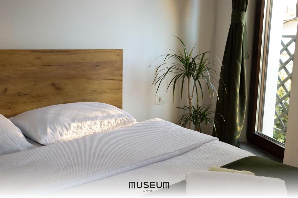 Postel nebo postele na pokoji v ubytování Museum Hotel
