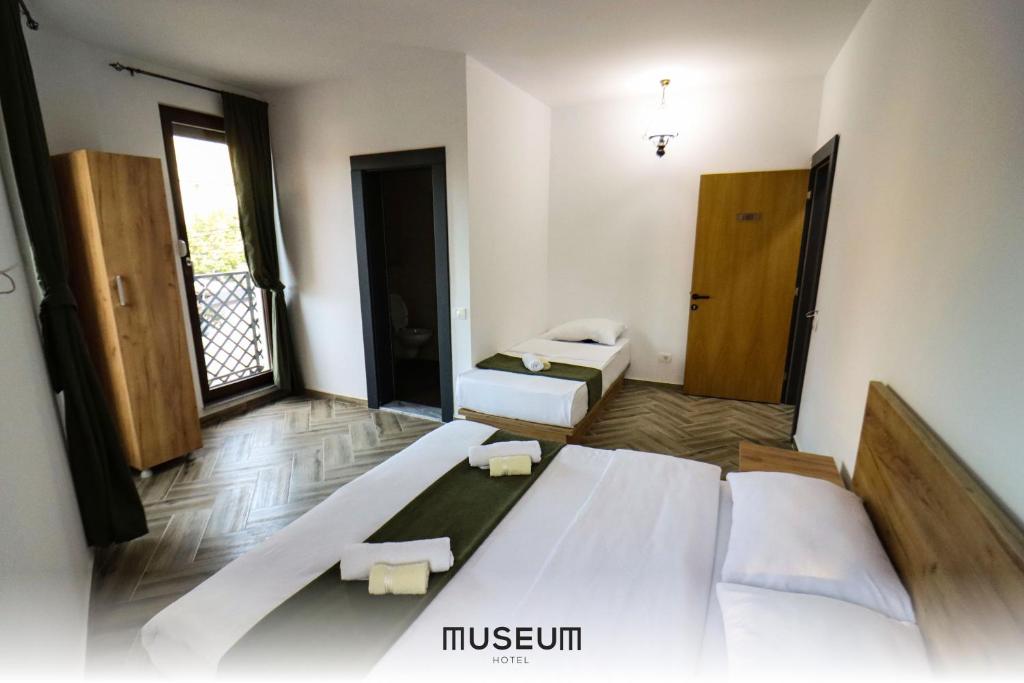 Postel nebo postele na pokoji v ubytování Museum Hotel