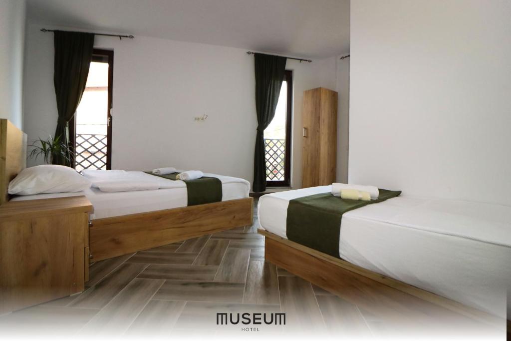 Postel nebo postele na pokoji v ubytování Museum Hotel