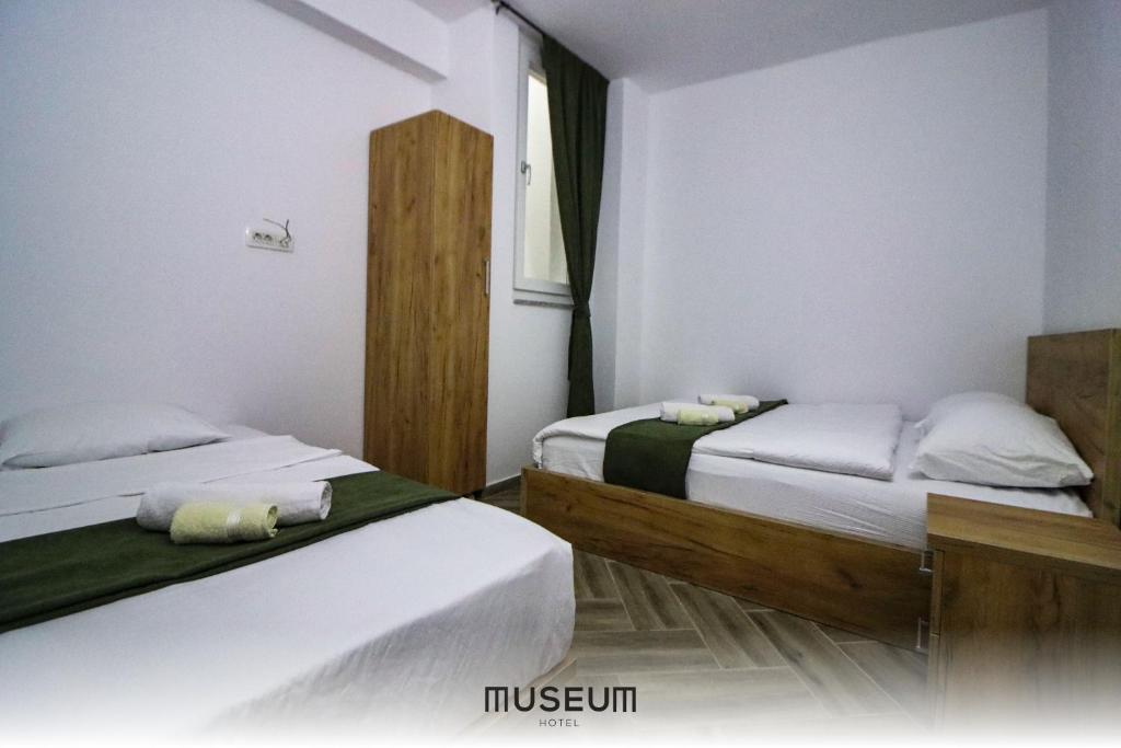 Postel nebo postele na pokoji v ubytování Museum Hotel