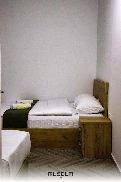 Postel nebo postele na pokoji v ubytování Museum Hotel