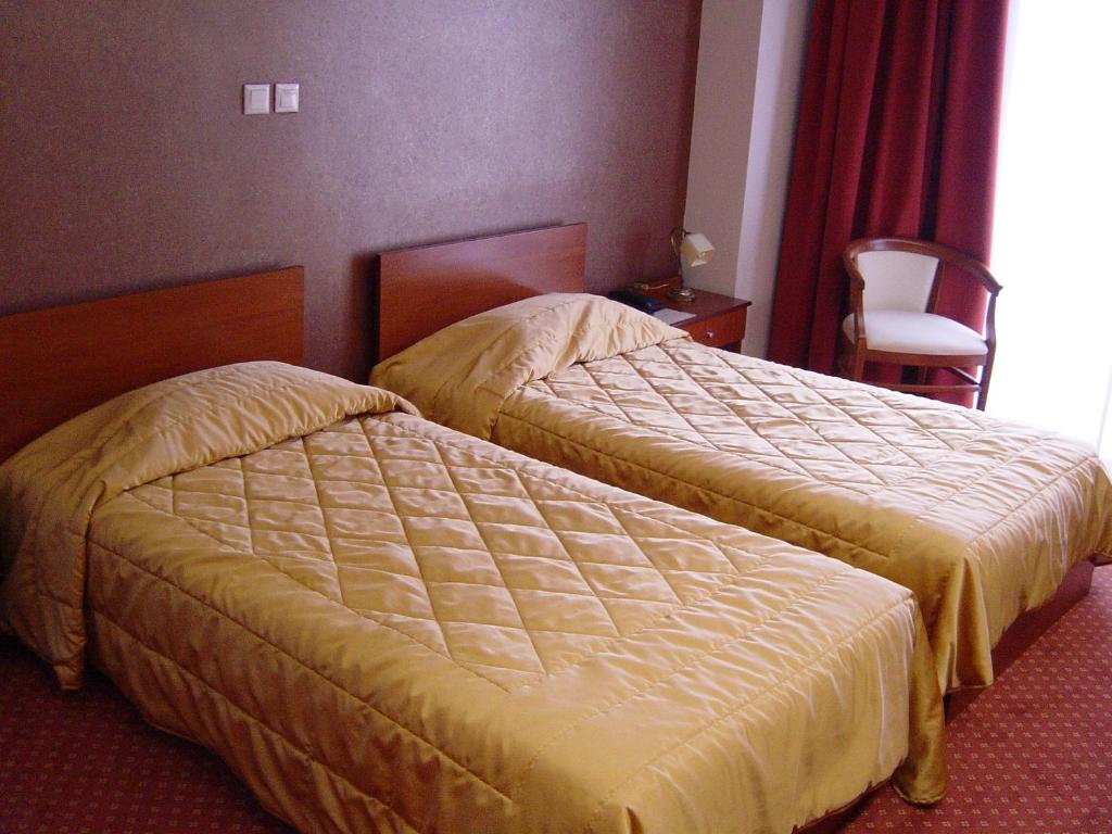 Postel nebo postele na pokoji v ubytování Achillio Hotel