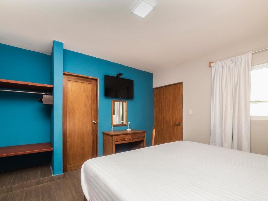 Postel nebo postele na pokoji v ubytování Hotel Meson del Barrio