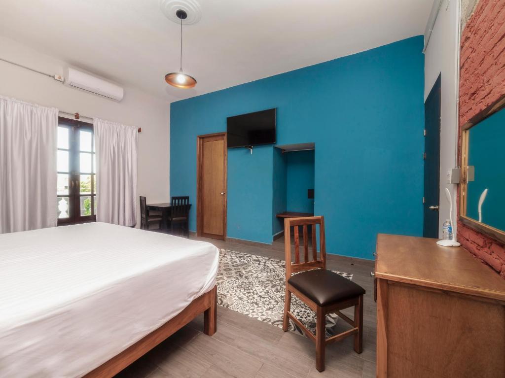 Postel nebo postele na pokoji v ubytování Hotel Meson del Barrio