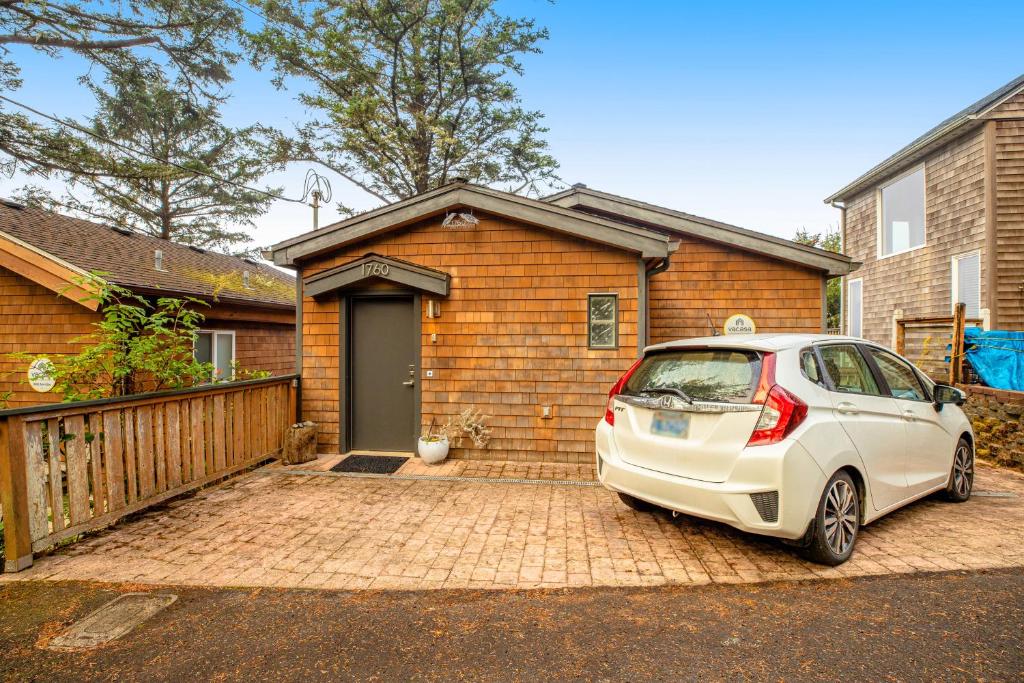 a car parked in front of a house at CrowsNest in Oceanside