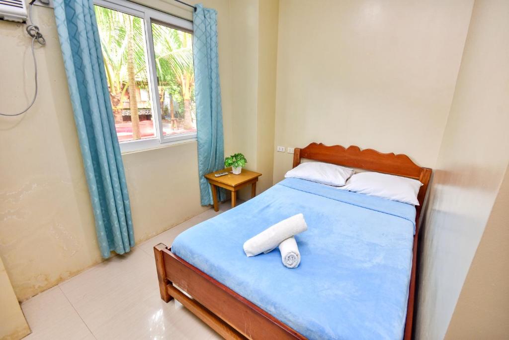 Postel nebo postele na pokoji v ubytování Boracay Backpackers