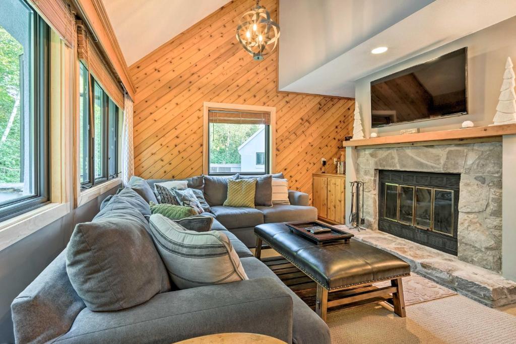 a living room with a couch and a fireplace at Family-Friendly Stratton Gem Close to Slopes! in Stratton