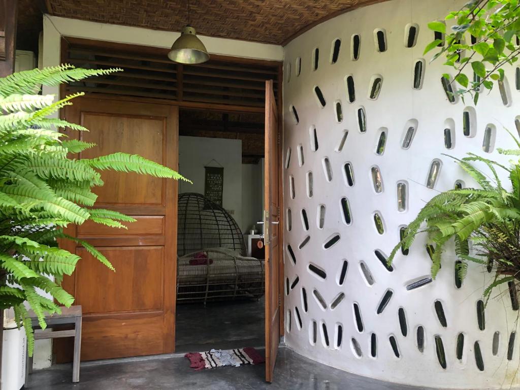 a hallway with a wall with holes in it at Yoga Lover in Yogyakarta