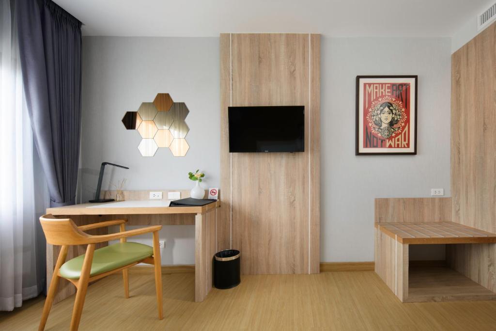 TV a/nebo společenská místnost v ubytování Prime Square Hotel