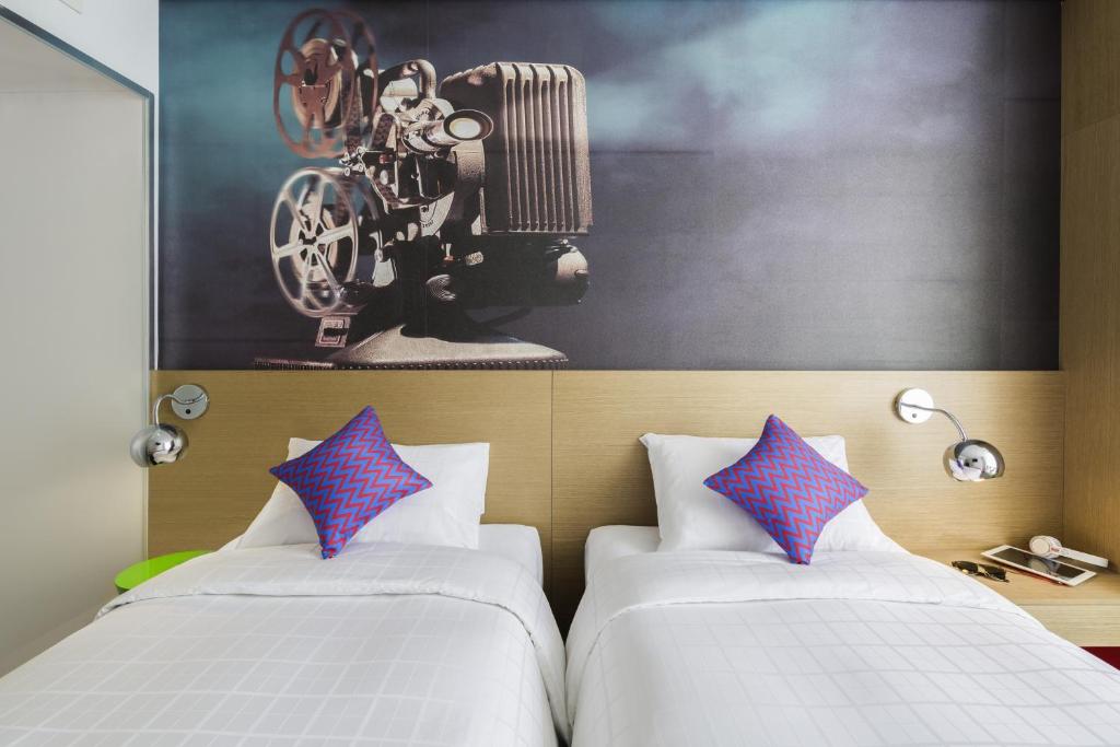 Postel nebo postele na pokoji v ubytování ibis Styles Ambassador Seoul Myeong-dong