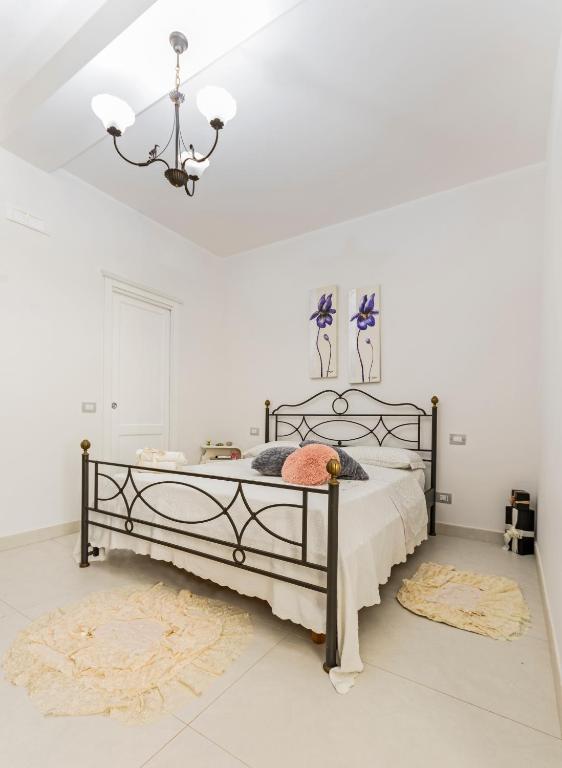 Posteľ alebo postele v izbe v ubytovaní Le Pendici Casa Vacanze