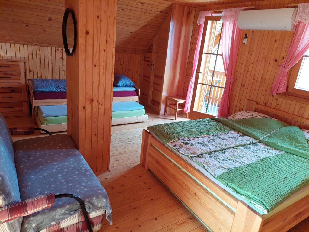 Postel nebo postele na pokoji v ubytování APARTMA-SPA NATURA