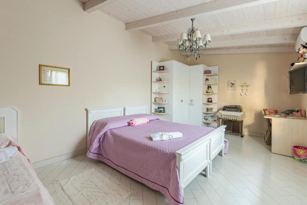 Posteľ alebo postele v izbe v ubytovaní Le Pendici Casa Vacanze