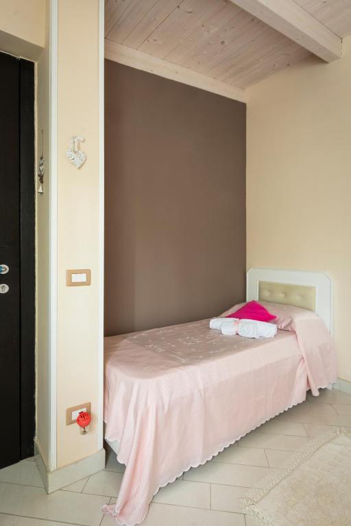 Posteľ alebo postele v izbe v ubytovaní Le Pendici Casa Vacanze