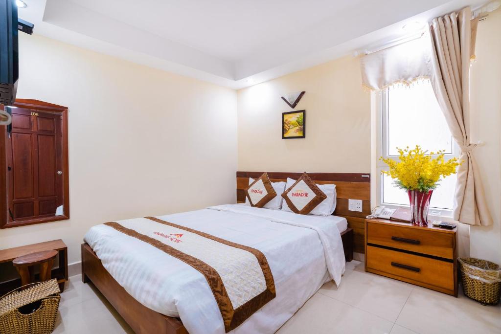 Postel nebo postele na pokoji v ubytování Paradise Hotel