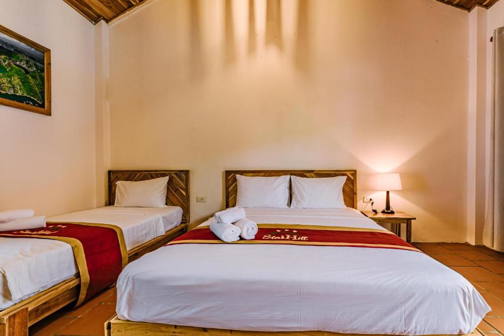 Postel nebo postele na pokoji v ubytování Star Hill Village Resort Phu Quoc