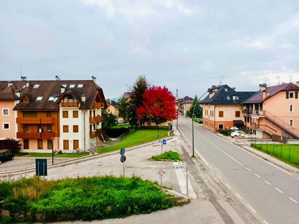 an empty street in a town with houses at Casa Bianchi in Asiago