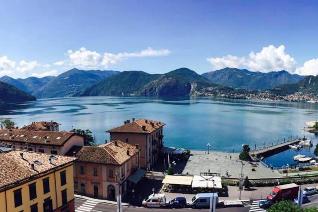 a view of a large body of water with mountains at Ottanio Lake Apartment in Pisogne