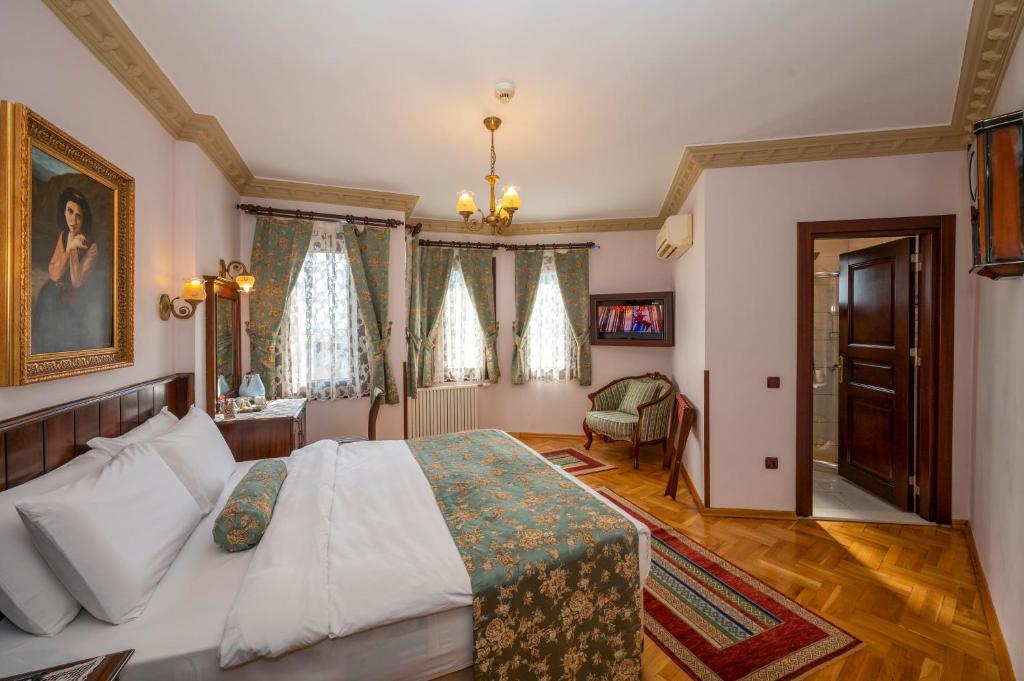 Postel nebo postele na pokoji v ubytování Osmanhan Hotel