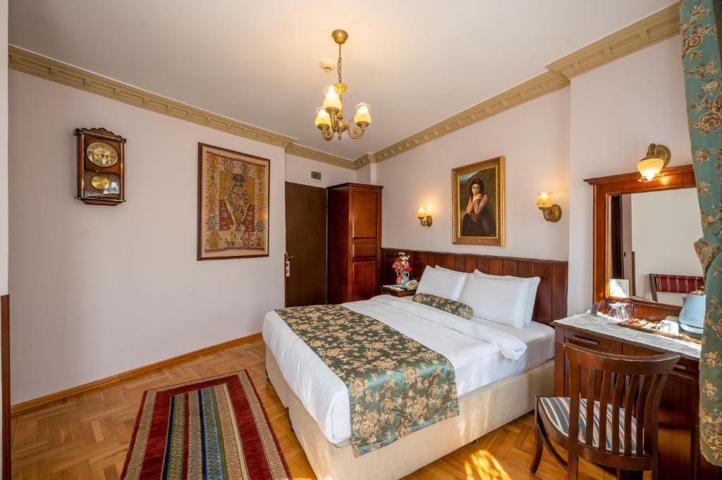 Postel nebo postele na pokoji v ubytování Osmanhan Hotel