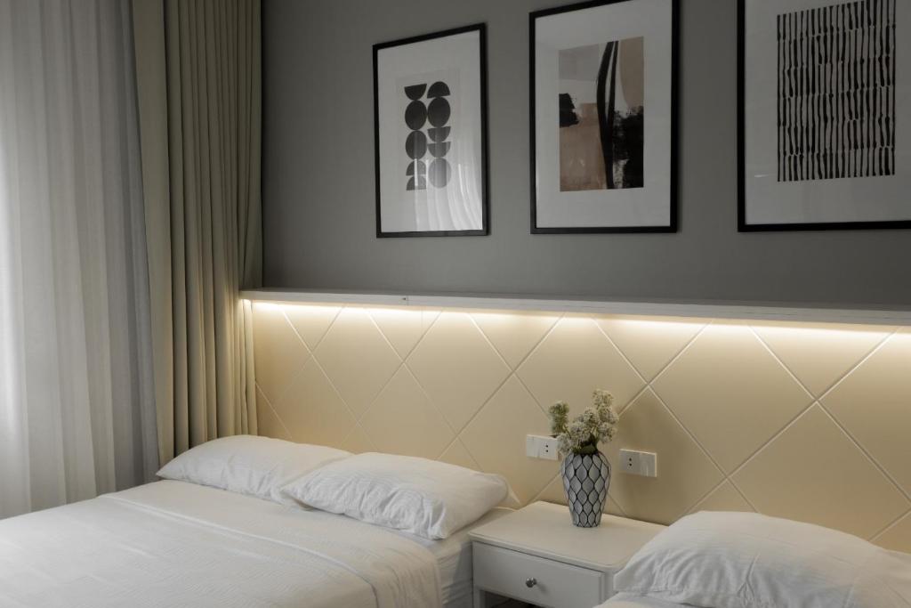 Postel nebo postele na pokoji v ubytování Twin Hearts Residences 1
