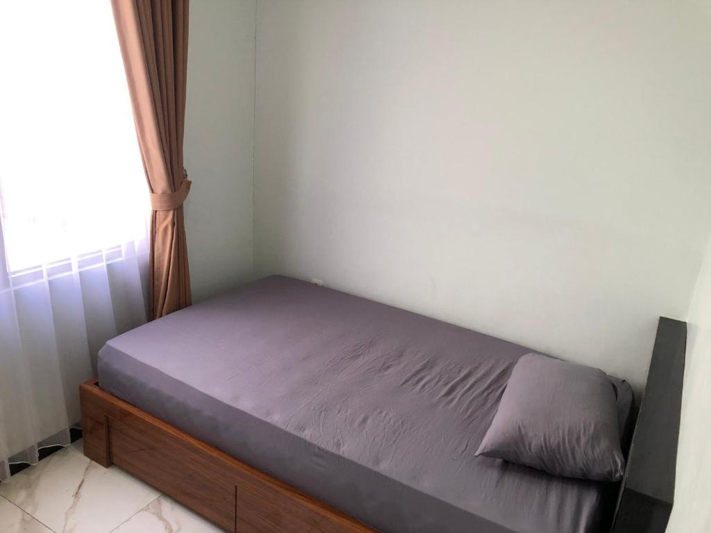 Postel nebo postele na pokoji v ubytování Bening Asri Guesthouse