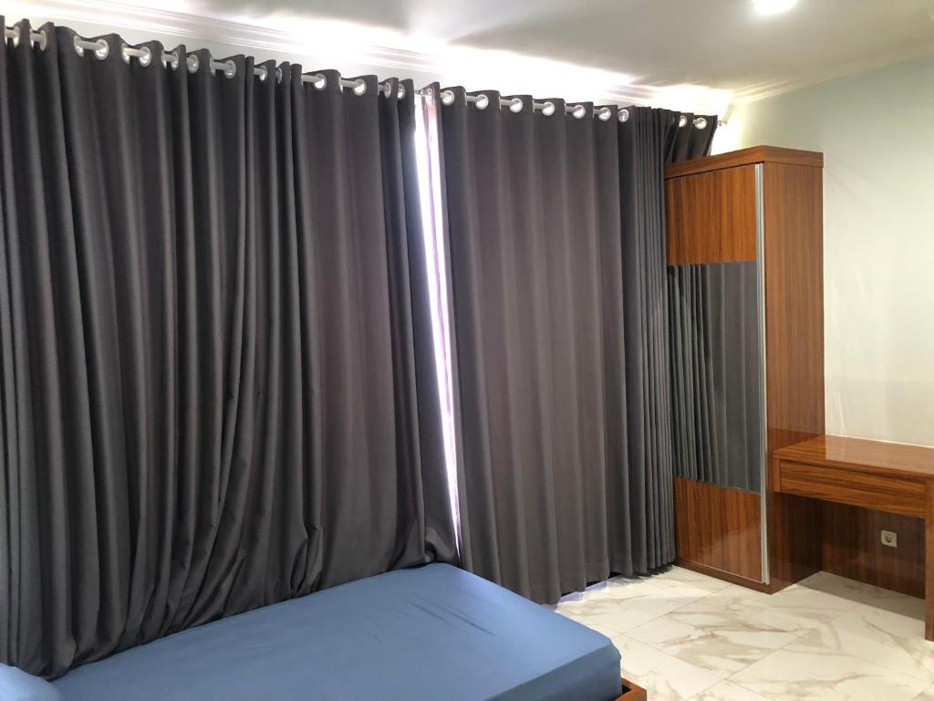 Postel nebo postele na pokoji v ubytování Bening Asri Guesthouse