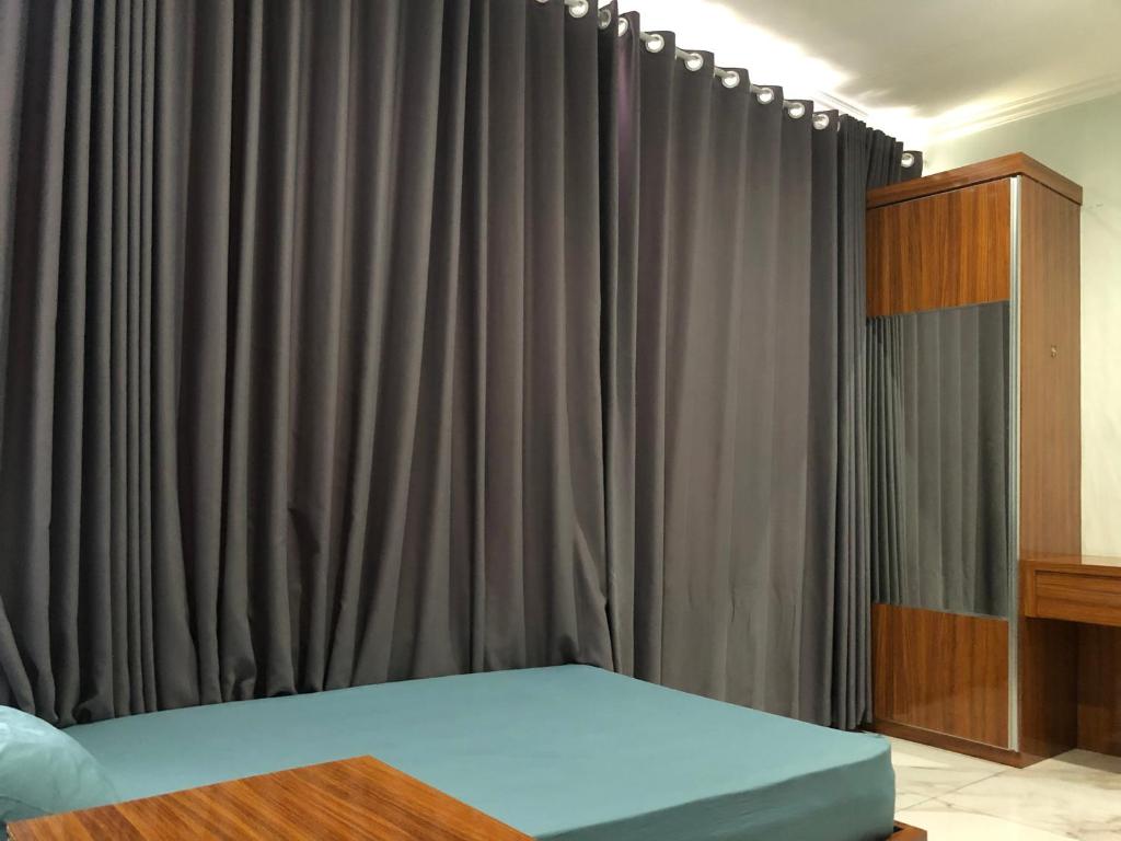 Postel nebo postele na pokoji v ubytování Bening Asri Guesthouse