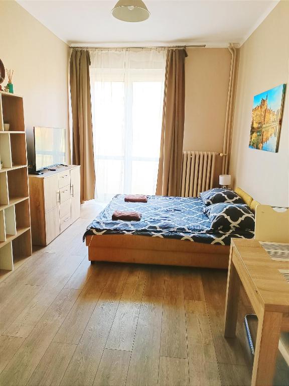 Postel nebo postele na pokoji v ubytování Bon Voyage Kawalerka