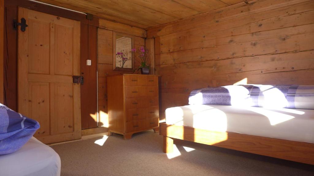 Ein Bett oder Betten in einem Zimmer der Unterkunft Hami