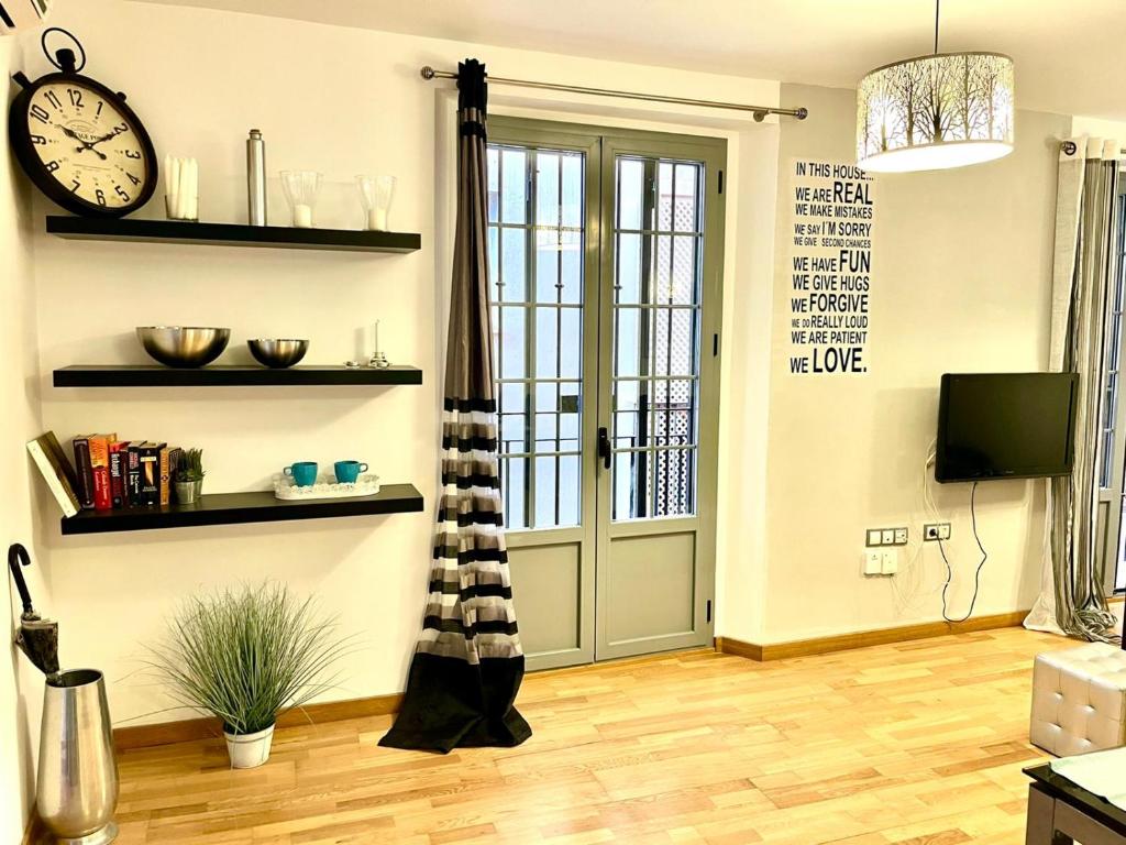 Televízia a/alebo spoločenská miestnosť v ubytovaní Apartamento Centro San Juan