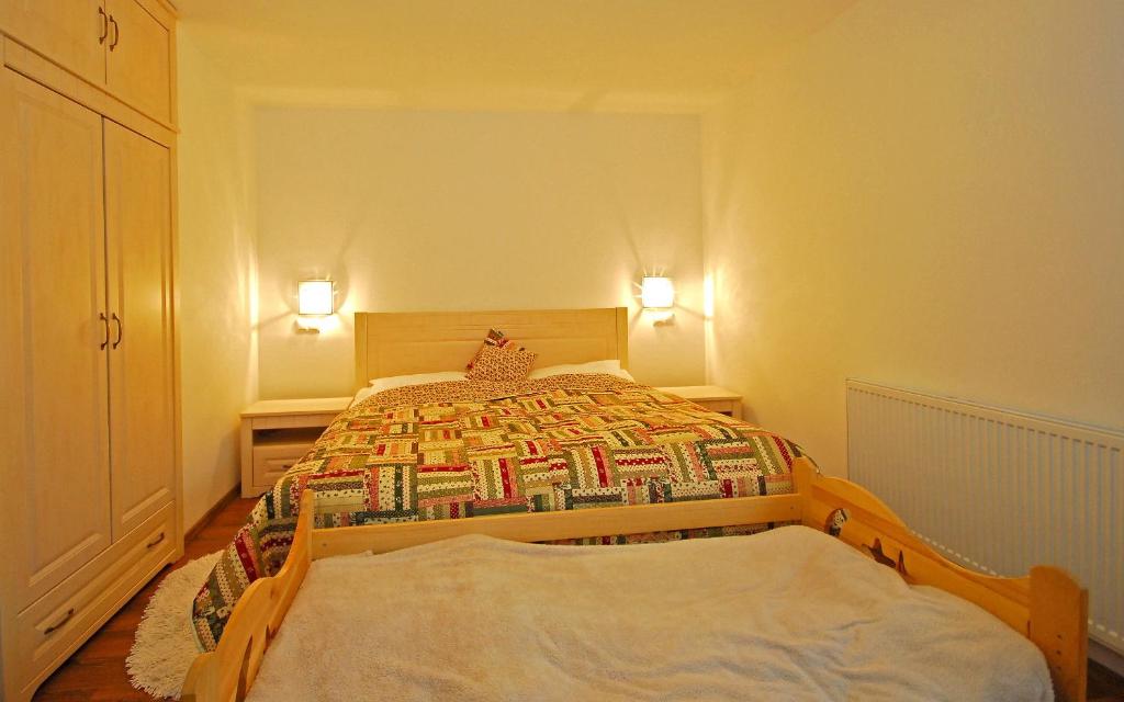 Postel nebo postele na pokoji v ubytování Apartment Bartek Ski Rental