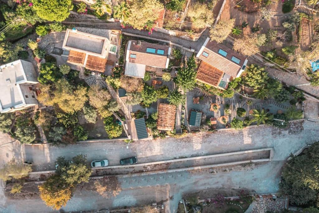 an aerial view of a house with a river at Ultava Houses in Datca