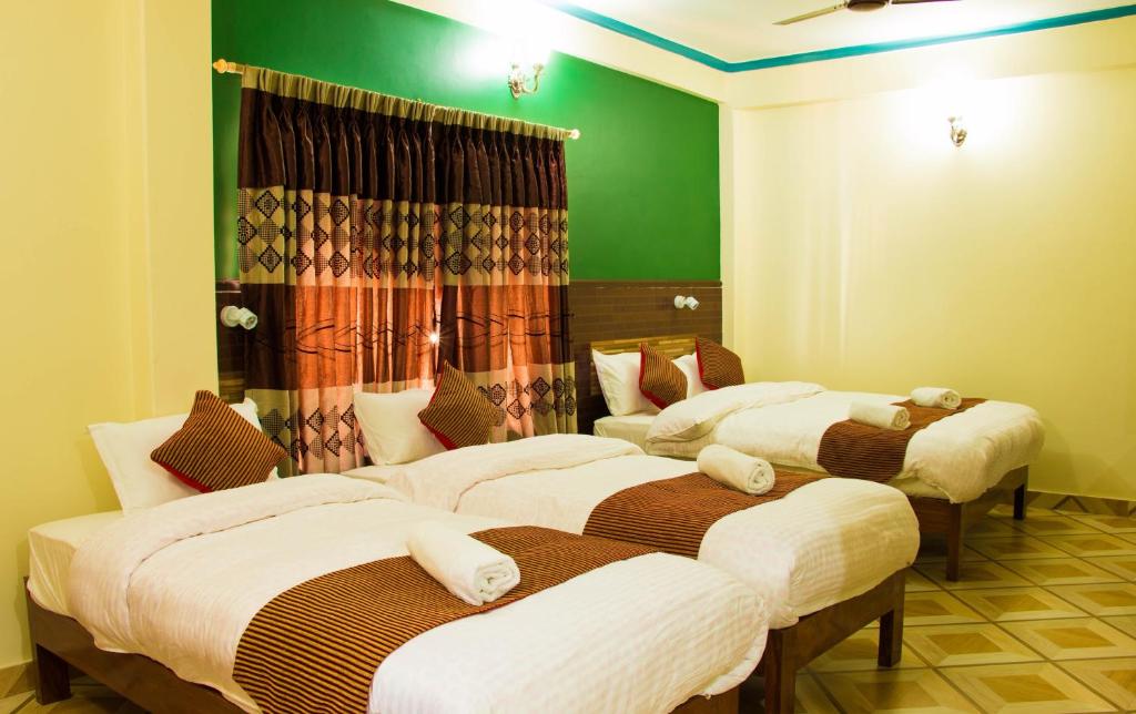 Cama o camas de una habitación en Hotel Adam