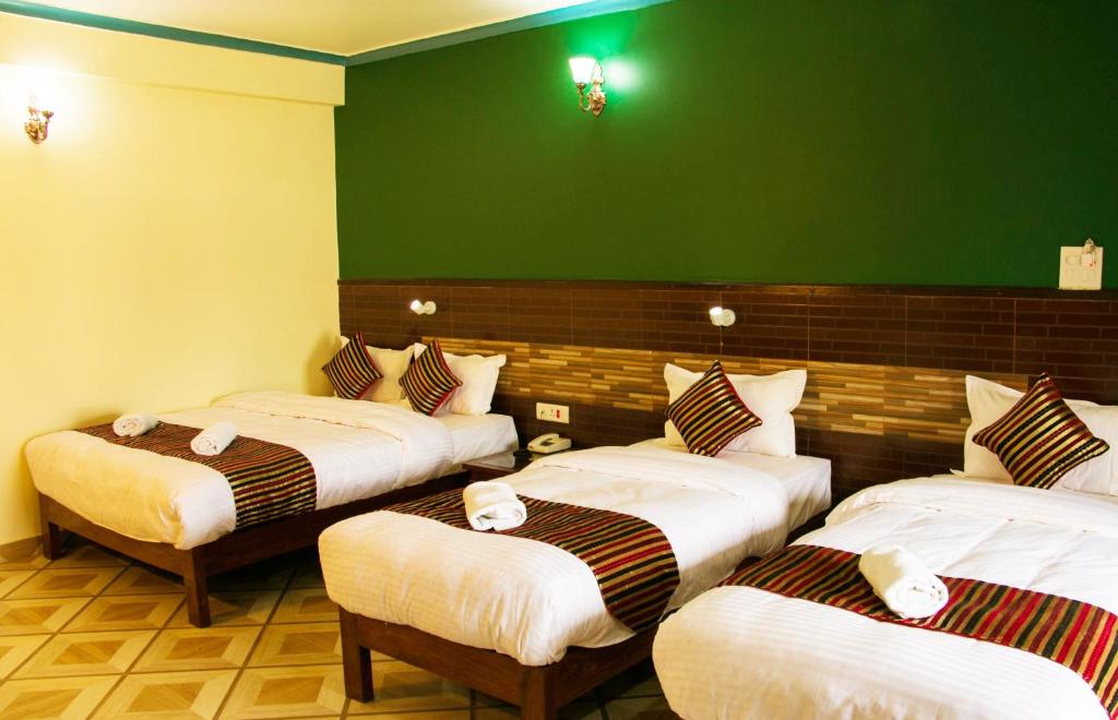 Cama o camas de una habitación en Hotel Adam