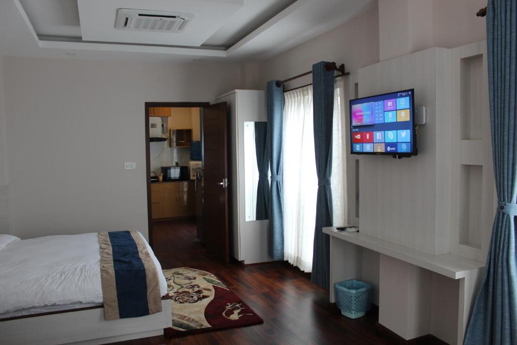 Postel nebo postele na pokoji v ubytování Hotel Mega & Apartment