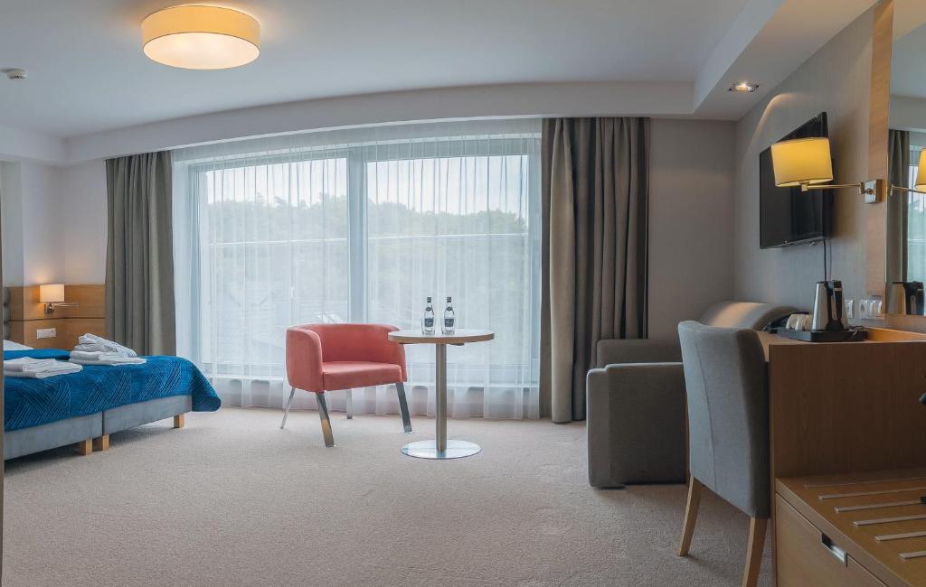 Postel nebo postele na pokoji v ubytování Hotel SKAL Medi SPA & Resort